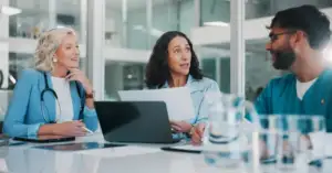 Clinical trial team discussing comparator sourcing strategy in a meeting